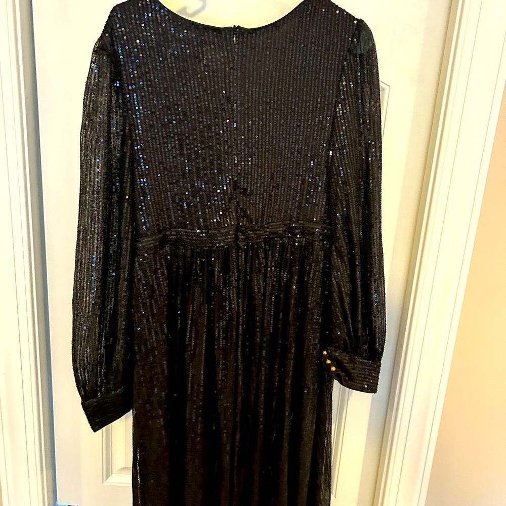 Woman’s black long sleeve sequence dress